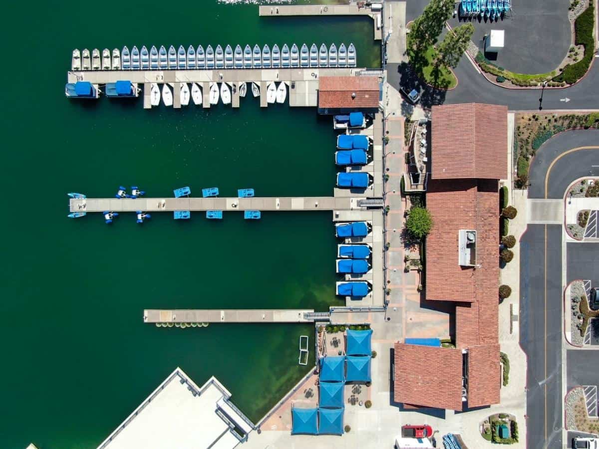 Aerial view of Lake Mission Viejo with recreational facilities and small pier at Playe Del Norte - California Places, Travel, and News.