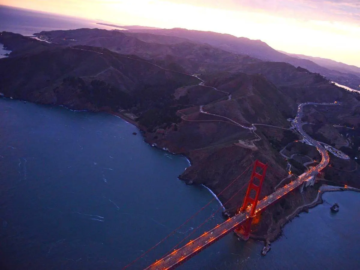 An Aerial View Of Golden Gate Bridge In San Francisco During Sunset Taken From A Helicopter - California View