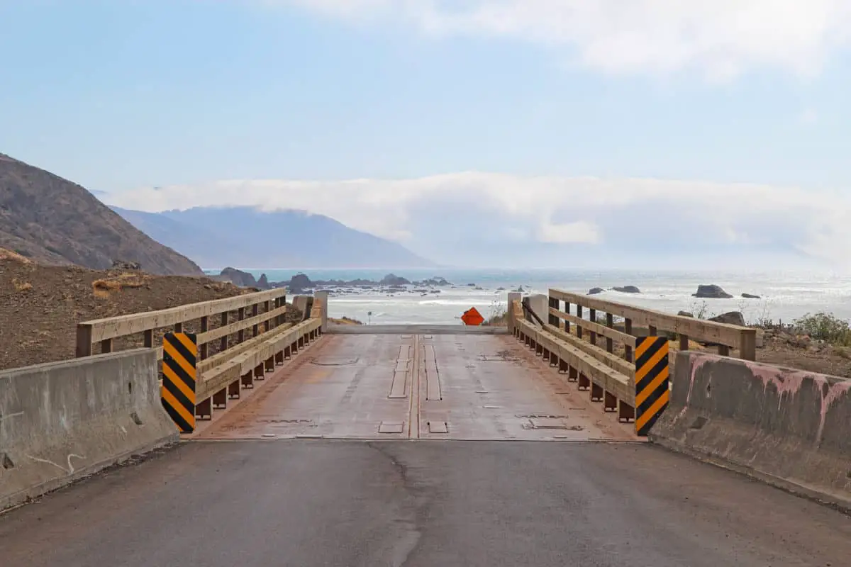 View of a bridge on Mattole Road as it heads towards the rocky beach on the Lost Coast of California. - California Places, Travel, and News.