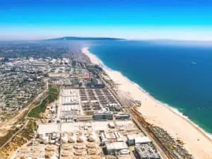 Aerial view of an oil refinery on the beach of LA. - California Places, Travel, and News.