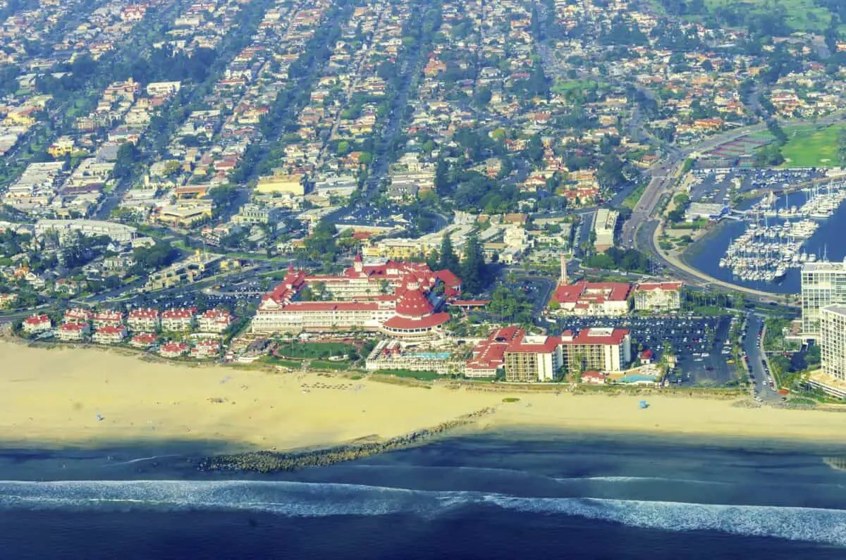 Aerial view of the Coronado island and in the San Diego Bay in Southern California United States of America. A view of the Skyline of the city the pacific ocean and the historic Hotel Del Coronado. - California Places, Travel, and News.