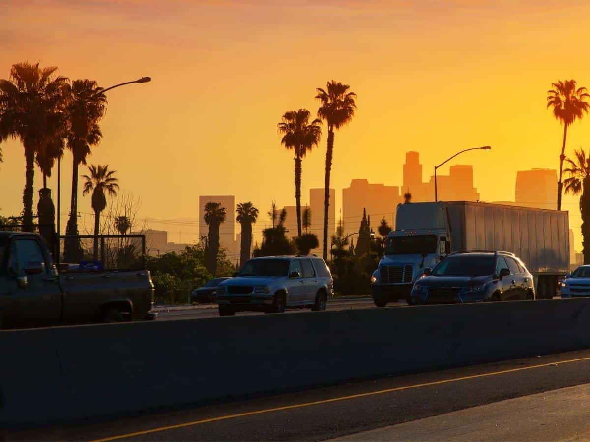 LA Los Angeles sunset skyline with traffic California from freeway. - California Places, Travel, and News.