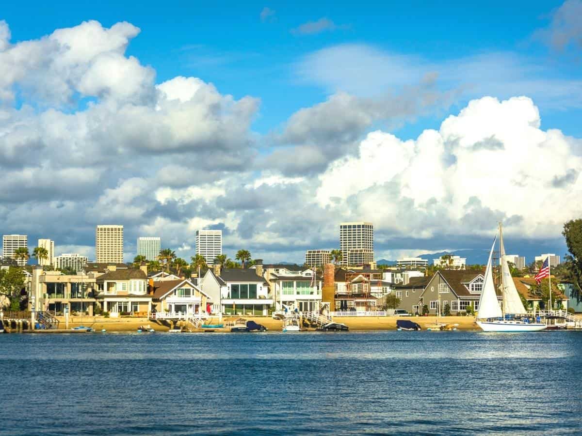 View of Balboa Island and buildings in Irvine from Newport Bea. - California Places, Travel, and News.