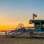 santa monica lifeguard tower and pacific park at background. - California Places, Travel, and News.