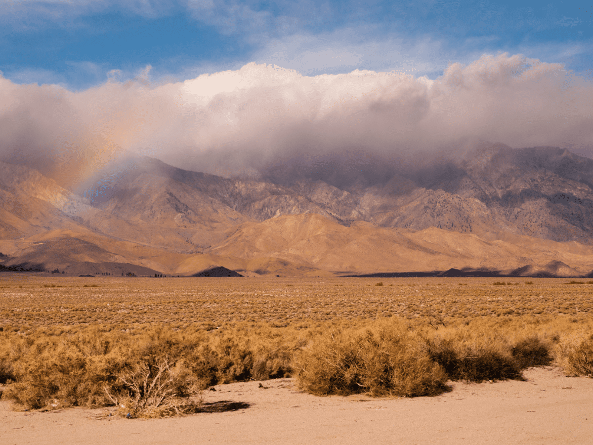 Rainbow Storm Brewing Rain Falling Sierra Nevada Range - California View