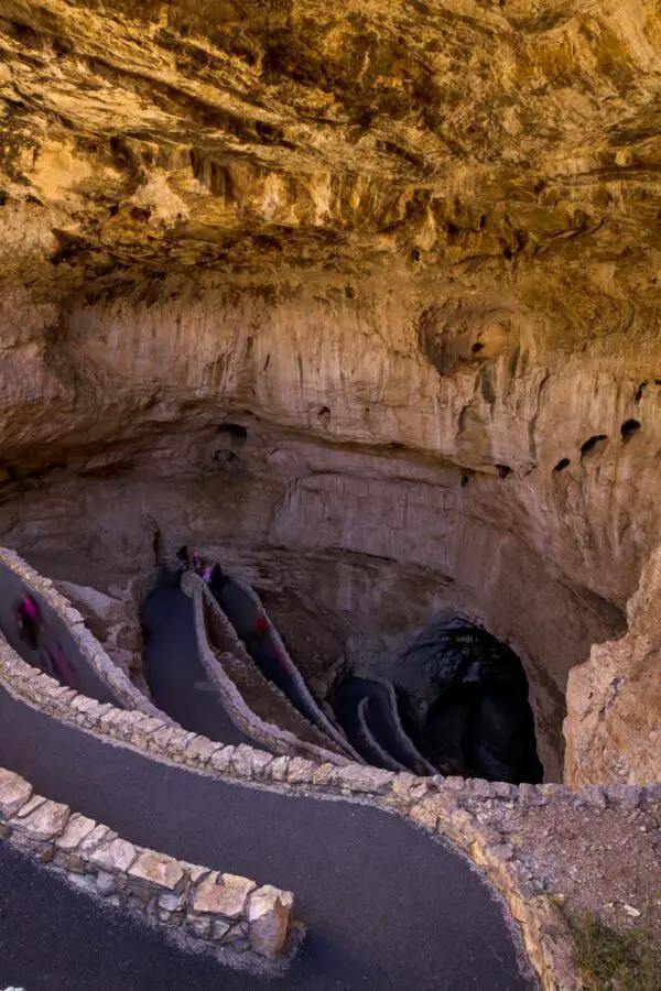 Switchback footpath winds into natural opening of Carlsbad Caverns. - California Places, Travel, and News.