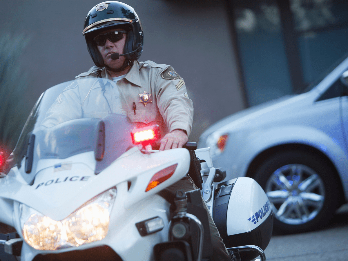 California Patrol Officer sits on motorcycle - California Places, Travel, and News.