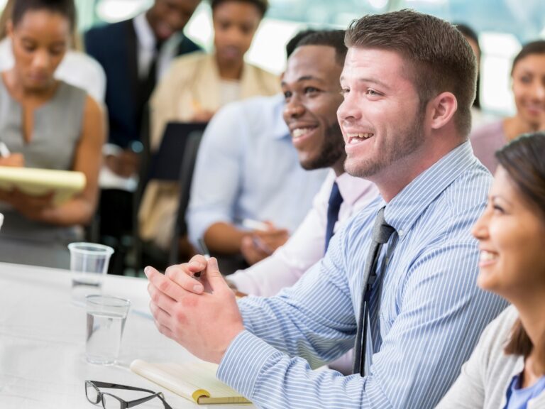 Graduate student panel laughs during business school lecture - California Places, Travel, and News.