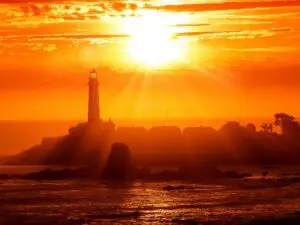 Peaceful sunset in California on the coast with a lighthouse - California Places, Travel, and News.