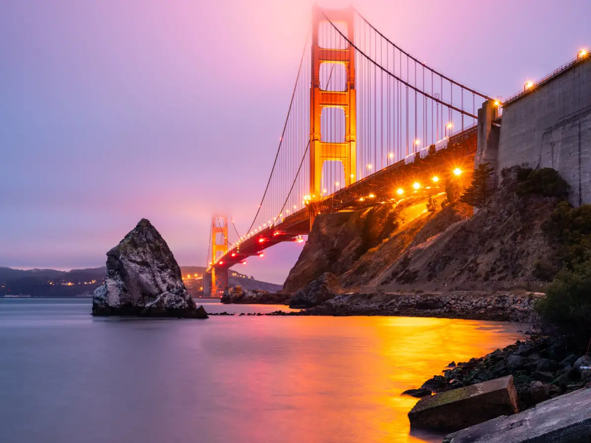 Golden Gate Bridge San Francisco California Under Purple Sky - California Places, Travel, and News.