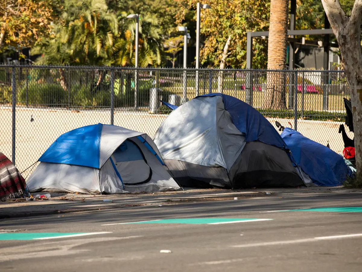 Homeless tent by the side of a road - California Places, Travel, and News.