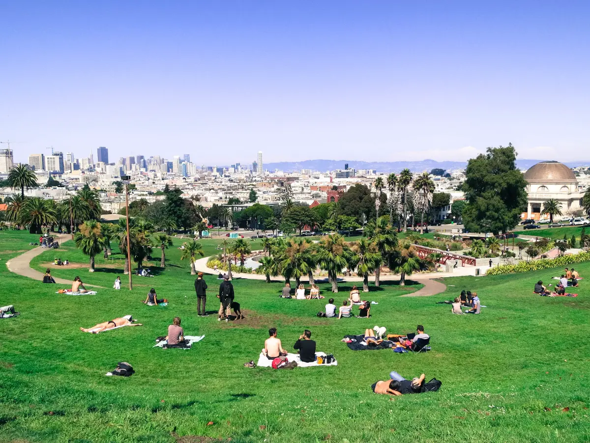 People on the grass at Mission Dolores Park San Francisco - California Places, Travel, and News.