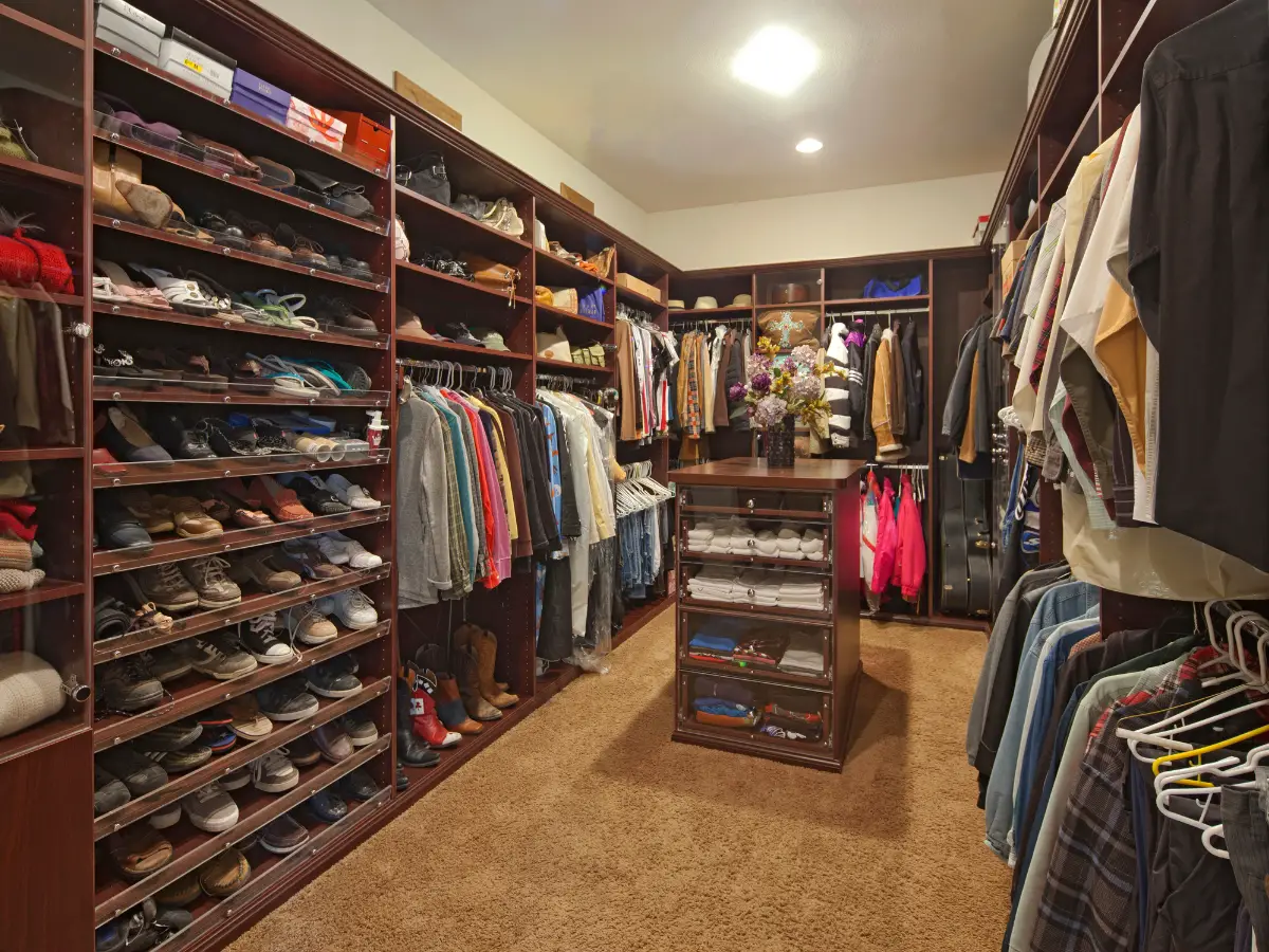 Walk in closet with organized clothing - California Places, Travel, and News.